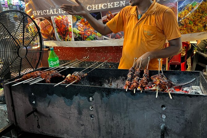 Mumbai Street Food & Bazaar Tour with Local Transport - Minara Masjid area: food right beside a major mosque